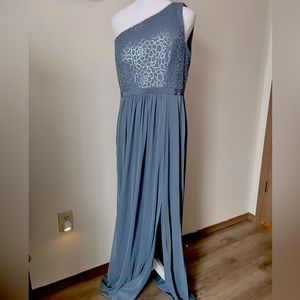 Bridesmaid Formal floor length gown in a Periwinkle color. Sequins top.